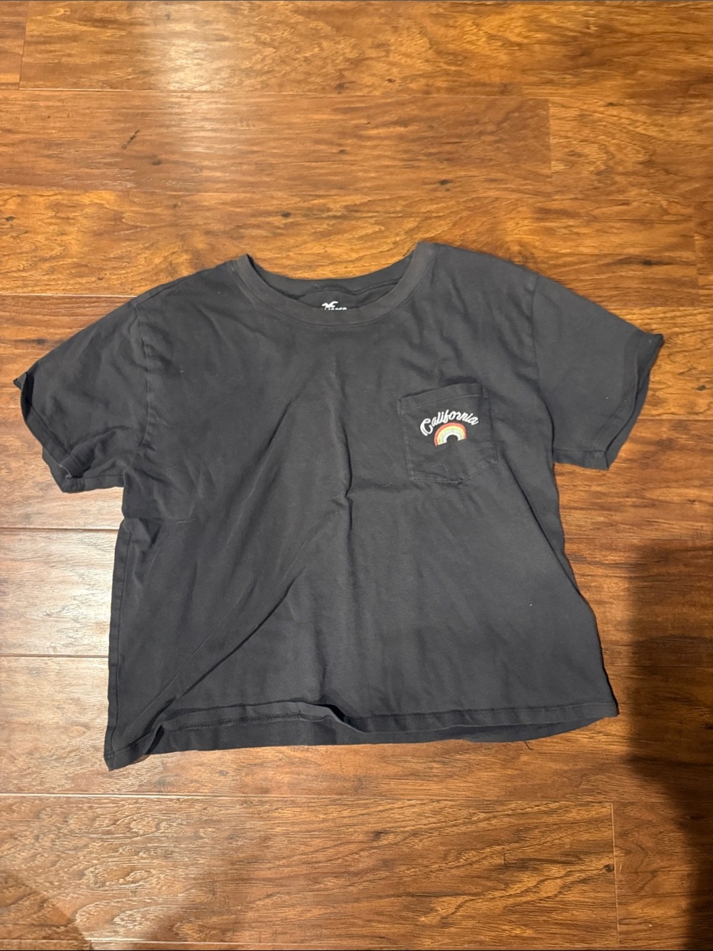 Hollister Black Short‑Sleeve Pocket Tee with Rainbow Accent